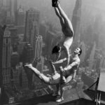 21 Aug 1934, Manhattan, New York City, New York State, USA --- Acrobats Jarley Smith (top), Jewell Waddek (left), and Jimmy Kerrigan (right) perform a delicate balancing act on a ledge of the Empire State Building in Manhattan. --- Image by © Bettmann/CORBIS